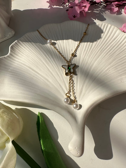 Butterfly with hanging pearl pendant