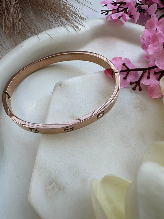 Rose gold cartier studded bracelet.