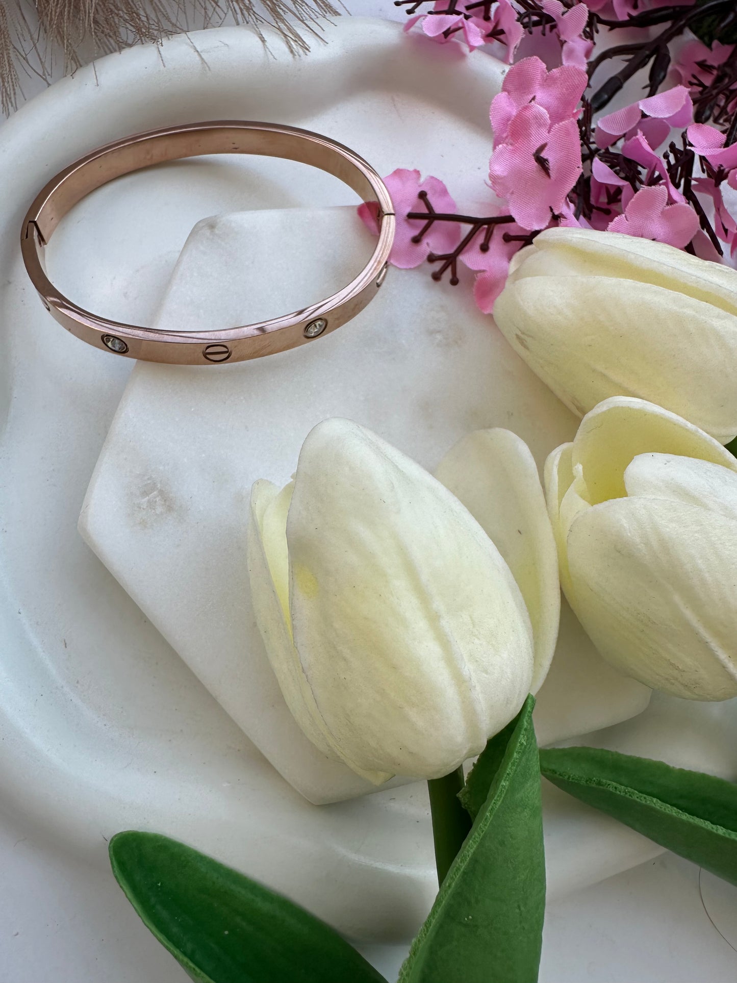 Rose gold cartier studded bracelet.