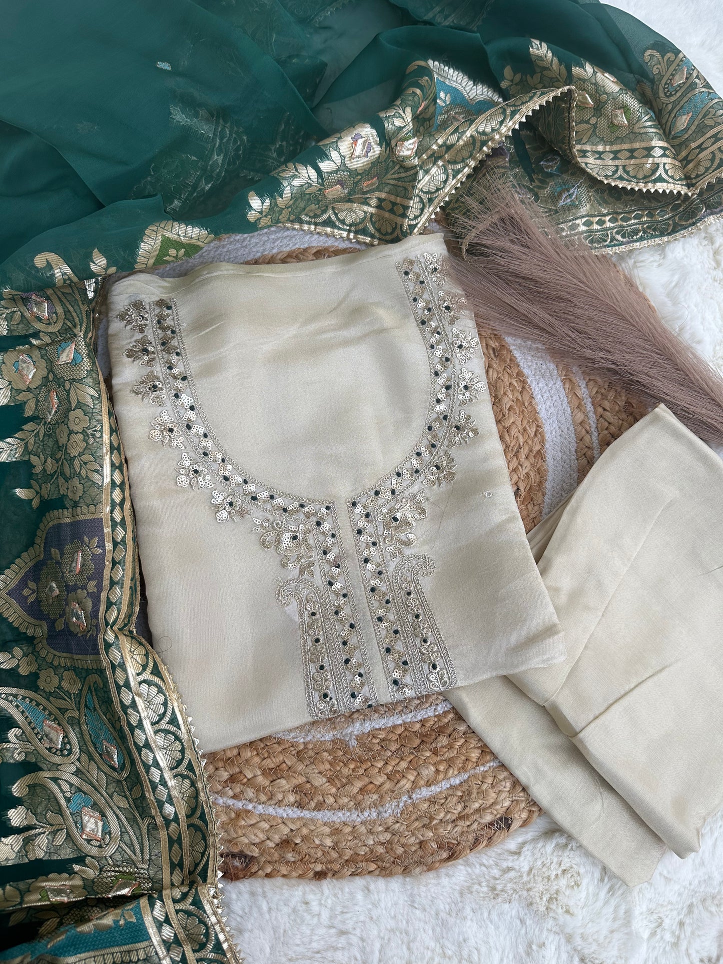 Off-white unstitched suit set with green dupatta