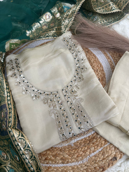 Off-white unstitched suit set with green dupatta