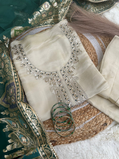 Off-white unstitched suit set with green dupatta