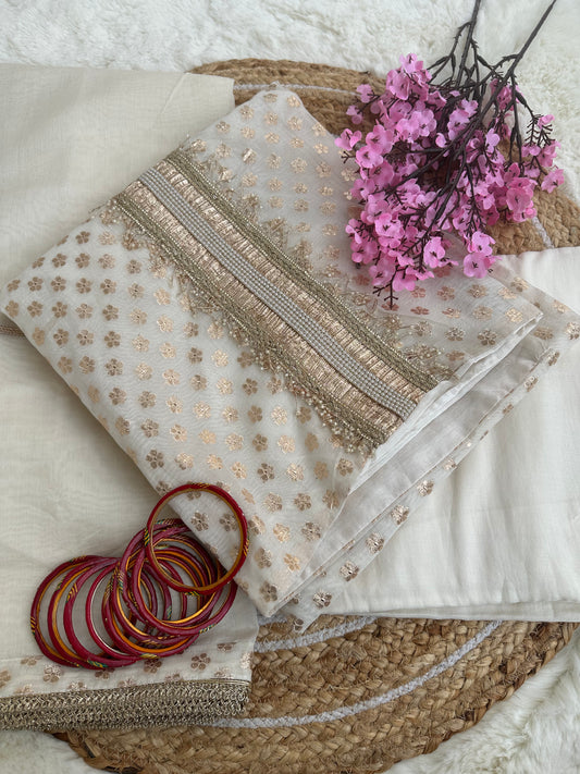 Beautiful off-white unstitched suit with golden work